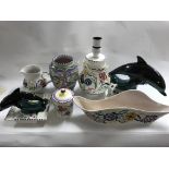 A collection of Poole pottery including two dolphi