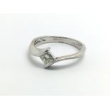 An 18ct white gold and princess cut diamond ring,