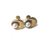 A pair of 9carat gold shell shaped earrings set wi