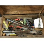 An old wooden tool chest containing various tools