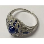 An Art Deco style platinum dress ring set with cen