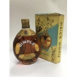 A boxed bottle of Haig's Dimple whisky.