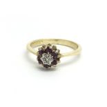 An 18ct yellow gold diamond and ruby cluster ring,