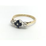 An 18ct yellow gold ring with four sapphires and t
