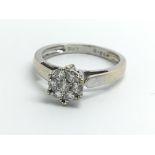 An 18ct white gold ring set with seven diamond in