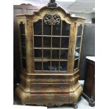 A walnut Dutch style display cabinet the single gl