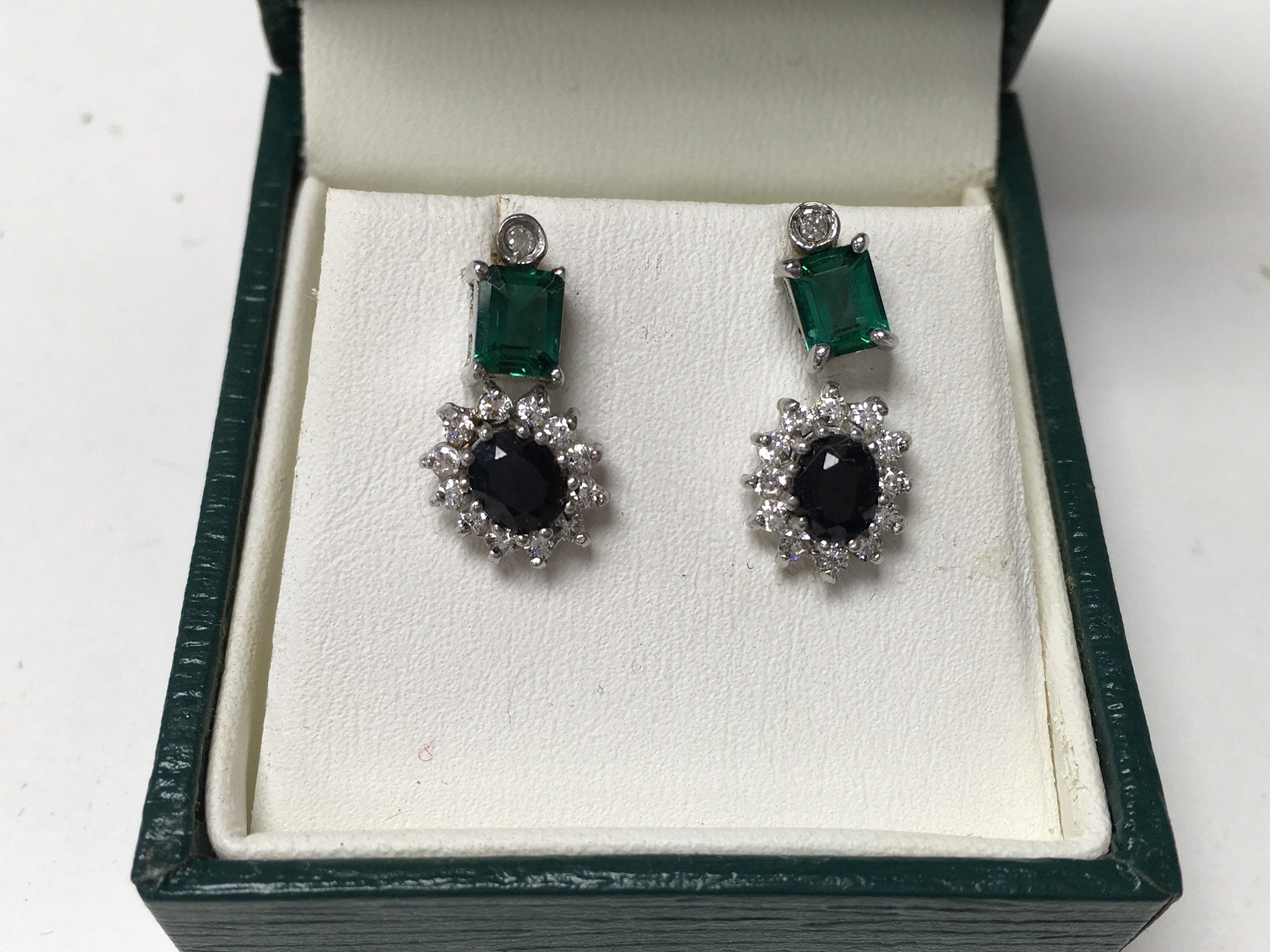 2 pairs of diamond and stone set studs.