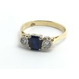 An 18ct yellow gold ring set with central sapphire