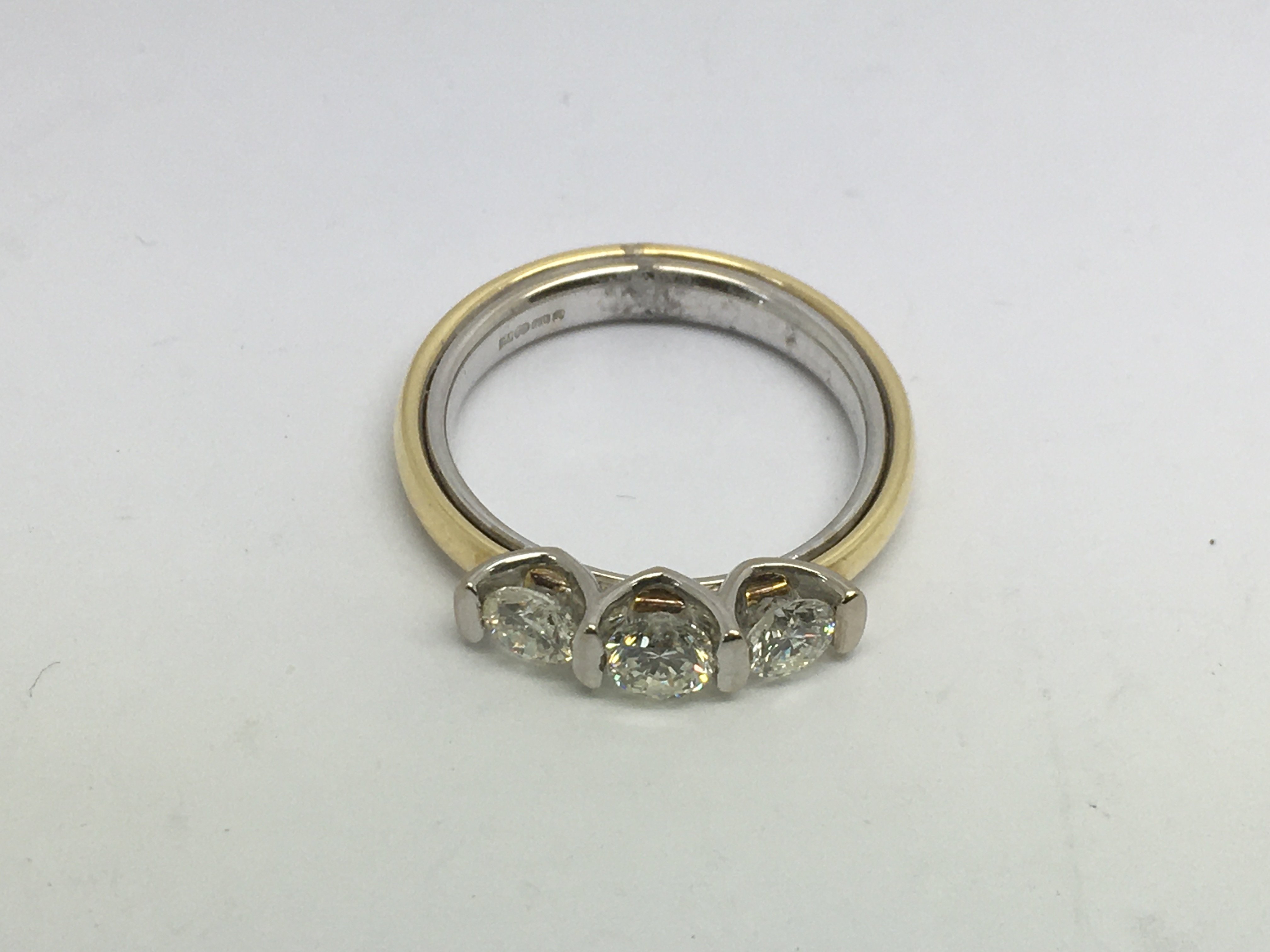 An 18ct gold three stone diamond ring, approx 1ct,