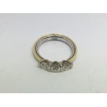 An 18ct gold three stone diamond ring, approx 1ct,