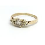 An 18ct yellow gold diamond ring, the central cham