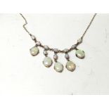 A 9carat gold and opal necklace with five oval han