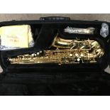 A cased Jupiter Saxophone