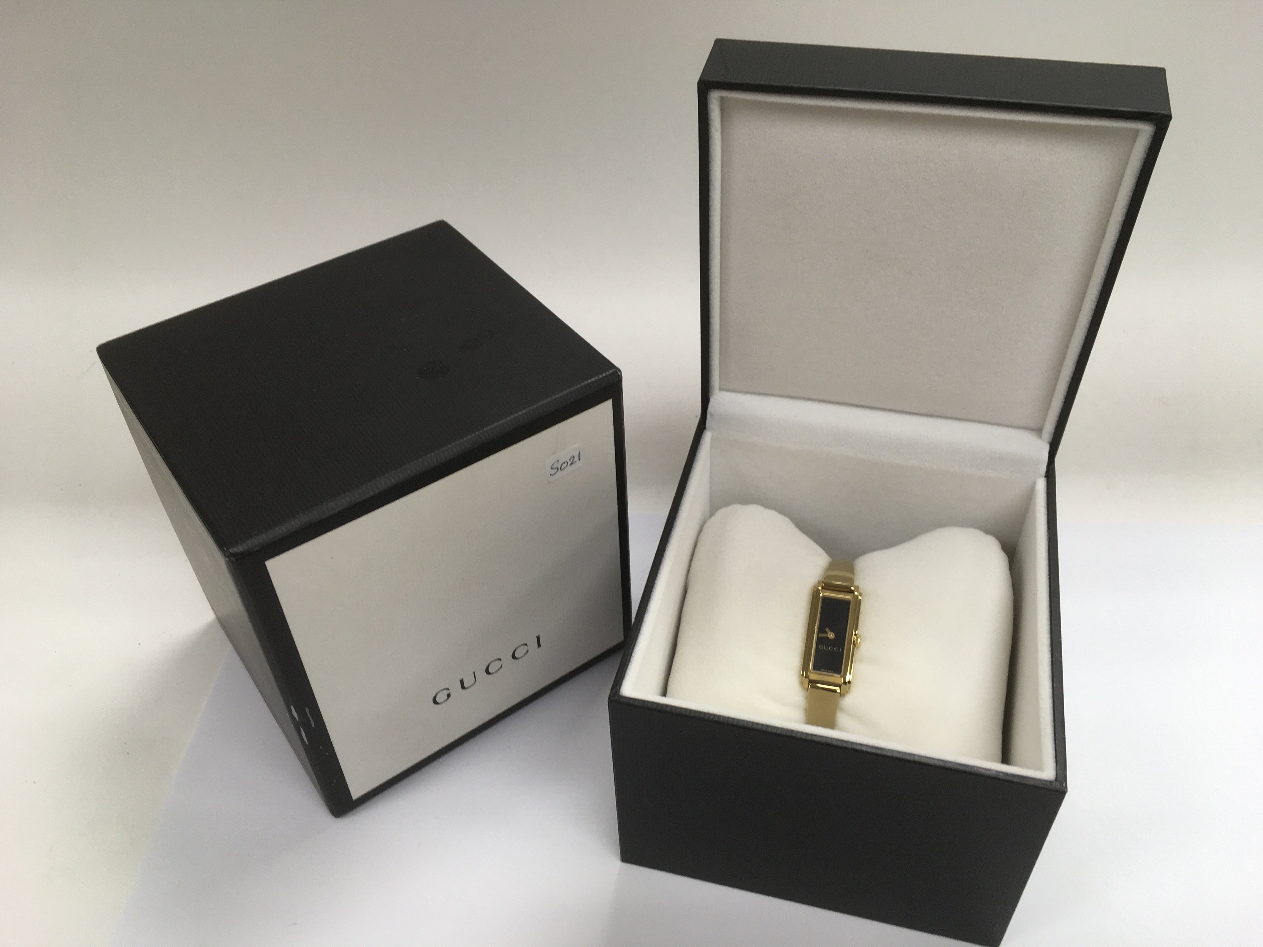 A boxed ladies Gucci dress watch.