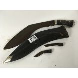 A Kukri with decorated handle in sheath with sharp