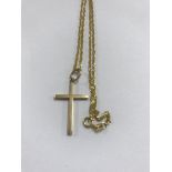 A 9 ct gold chain with attached cross.