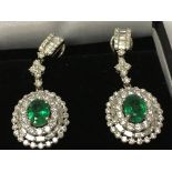 18ct white gold oval cut emerald and diamond clust