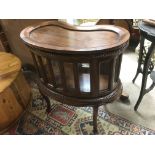 A reproduction glazed mahogany cabinet with kidney