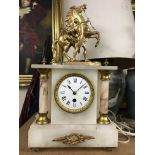 A alabaster mantel clock the top surmount with a gilt Marley horse .