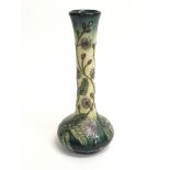 A Moorcroft stem vase with purple dandelion type f