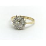 An 18ct yellow gold and diamond cluster ring, appr