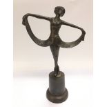 A bronzed metal figure of an Art Deco style lady,