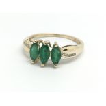 A 9ct yellow gold and three emerald dress ring, ap