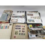 A collection of stamps, first day covers and postc