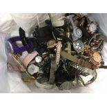 A bag of used designer quartz watches.