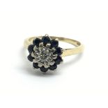 An 18ct yellow gold sapphire and diamond cluster r