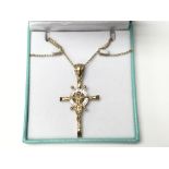A 9ct gold Jesus on cross pendant on 9ct gold chai