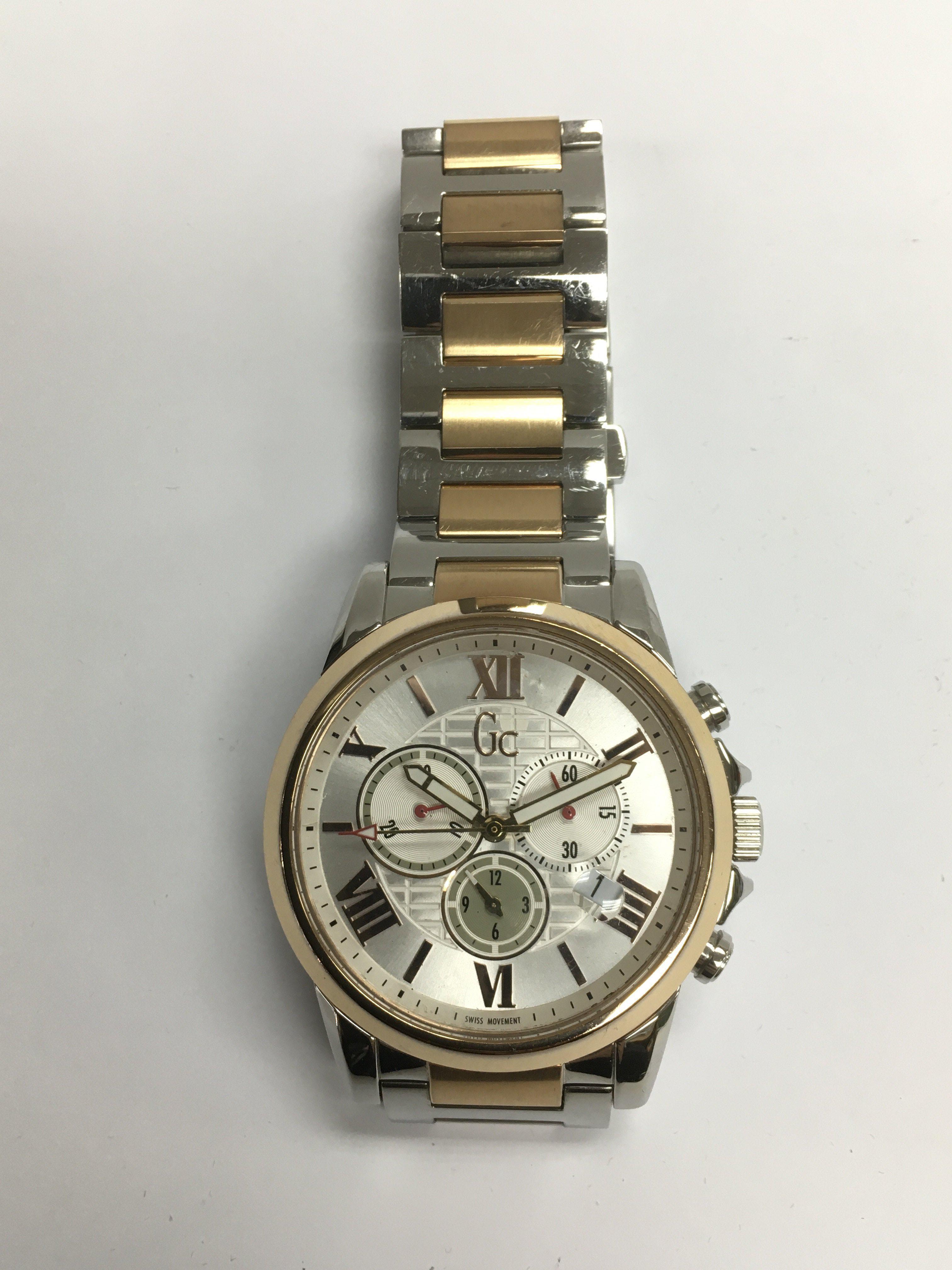 A gents Guess stainless steel watch.