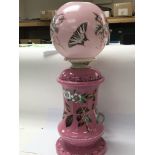 A Victorian pink glass oil lamp enamel decorated w