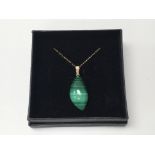 A malachite pendant on 9ct chain