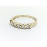 A 9ct yellow gold and five diamond half eternity r