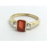 An 18ct yellow gold ring set with fire opal and tw