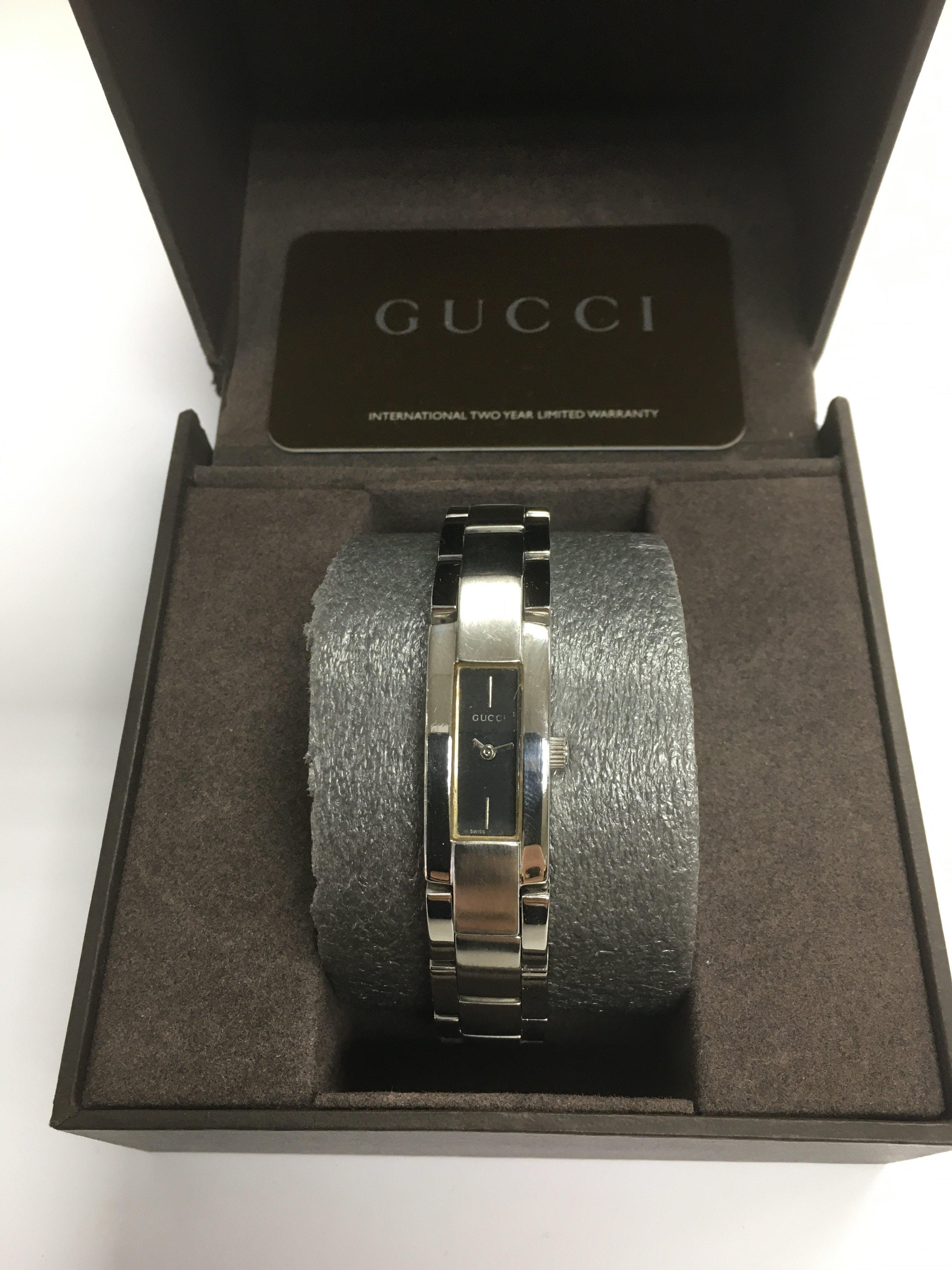 A boxed Gucci bangle watch.