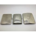 Three silver cigarette cases, different assays.