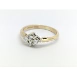 A 9ct yellow gold and four stone diamond ring, app