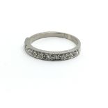 An 18ct white gold eleven stone diamond ring, appr