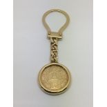 A 9ct gold Mercedes key ring, approx 14.7g.
