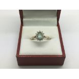 A 9ct gold ring set with an aquamarine stone, appr