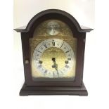 An arch topped mantle clock.