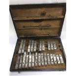 A vintage cased set of chime bars.