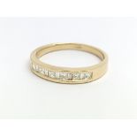 An 18ct yellow gold and princess cut diamond half