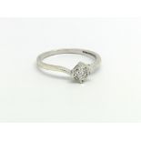 A 9ct white gold and diamond solitaire ring, appro