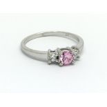 A 9ct white gold, pink sapphire and diamond ring,