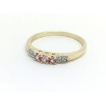 A 9ct yellow gold pink sapphire and diamond ring,