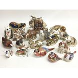 A collection of 19 Royal Crown Derby paperweights