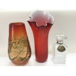 Two coloured glass vases and a glass decanter with